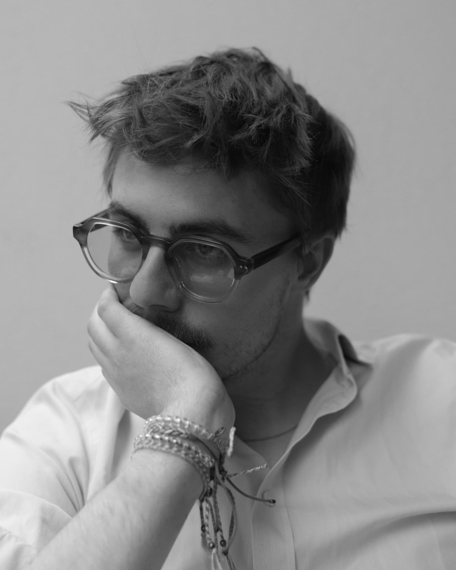Jonathan Tinne, black and white portrait wearing glasses